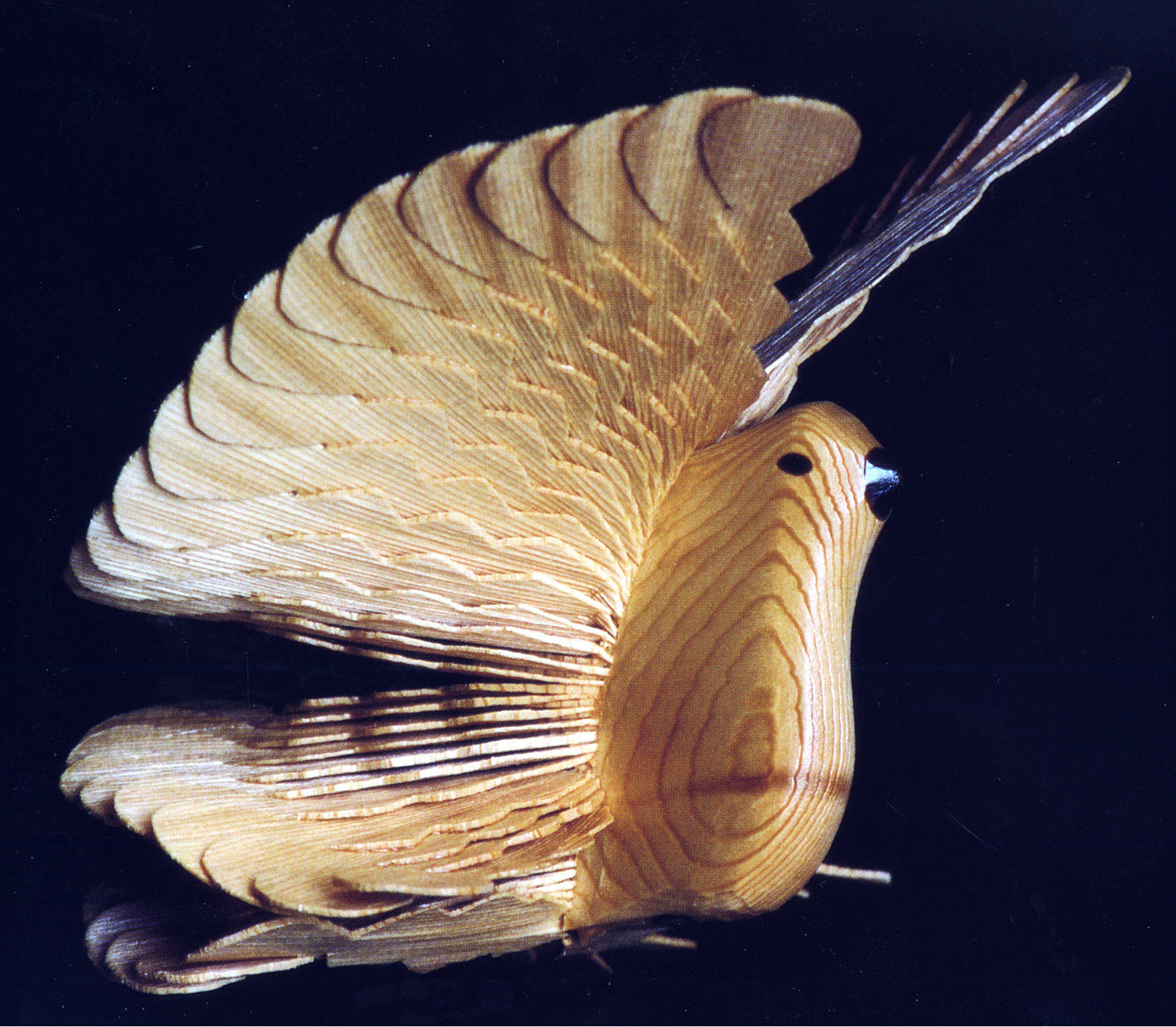 a cedar fan carved bird