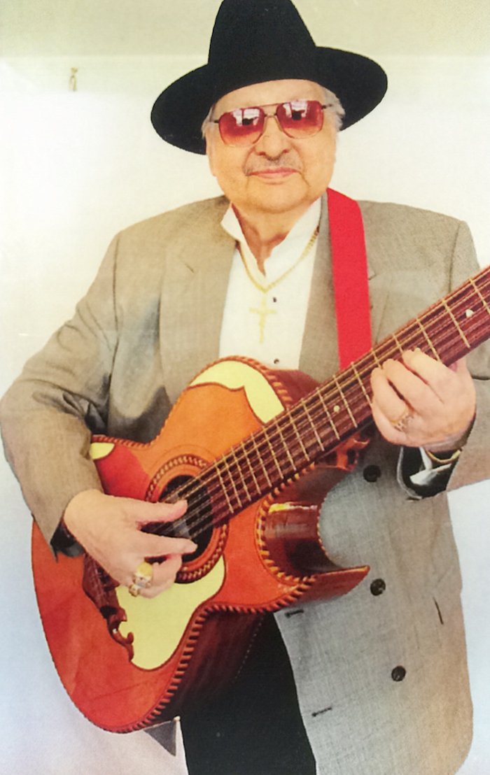 Martin Solis holding his bajo sexto